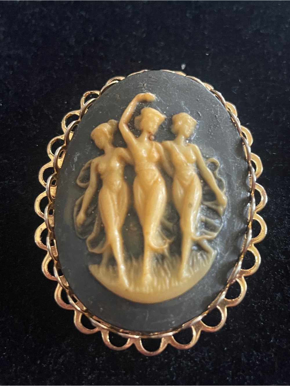 This vintage cameo brooch features the "Three Graces" classical filigree!